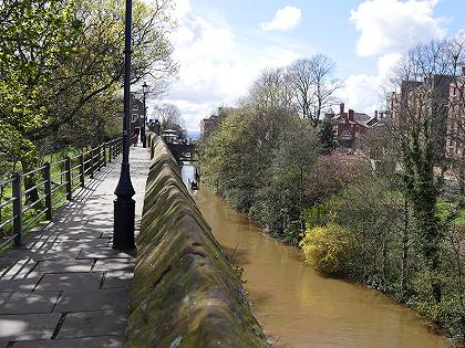 View of a narrowboat on the Shropshire Union Canal from the viewpoint of the Chester City Walls