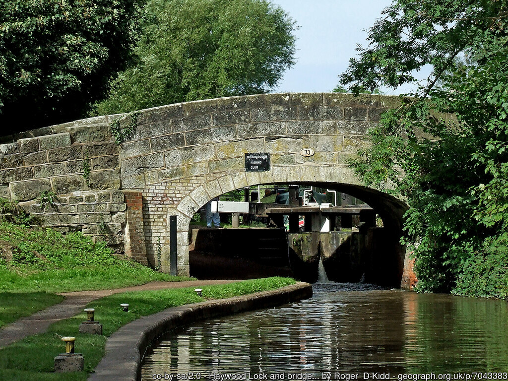 Boat descending haywood lock with bridge 73 in the foreground